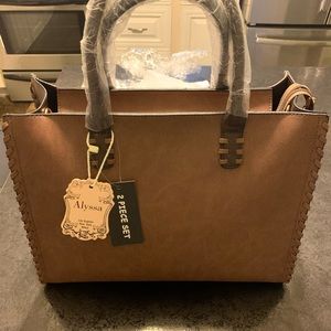 Large two piece set of vegan leather bags.